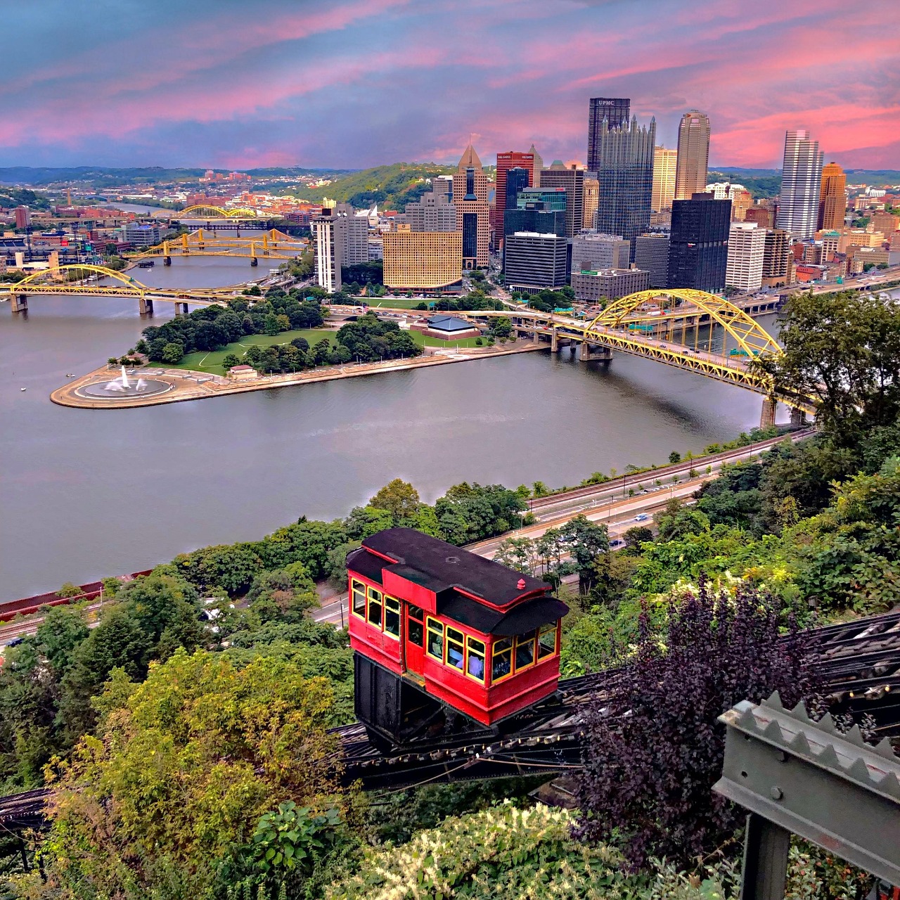 The Duquesne Incline climbing Mount Washington above the rivers at dusk